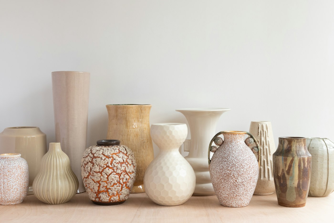 Collection of ceramic vases in neutral tones